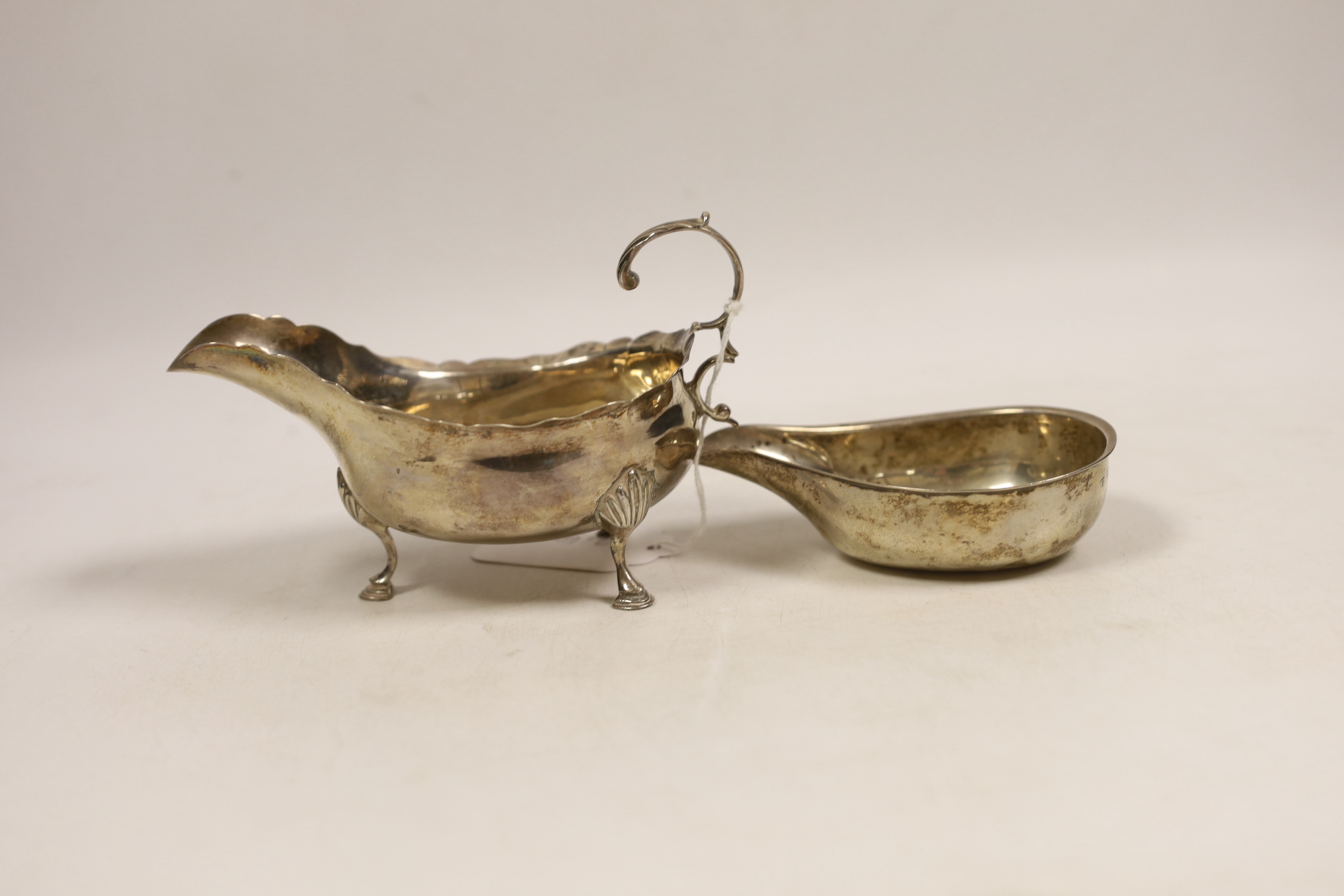 A George III silver sauceboat, by Peter, Ann & William Bateman, London, 1802, length 14.5cm (splits) and a George III silver pap boat, London, 1791.